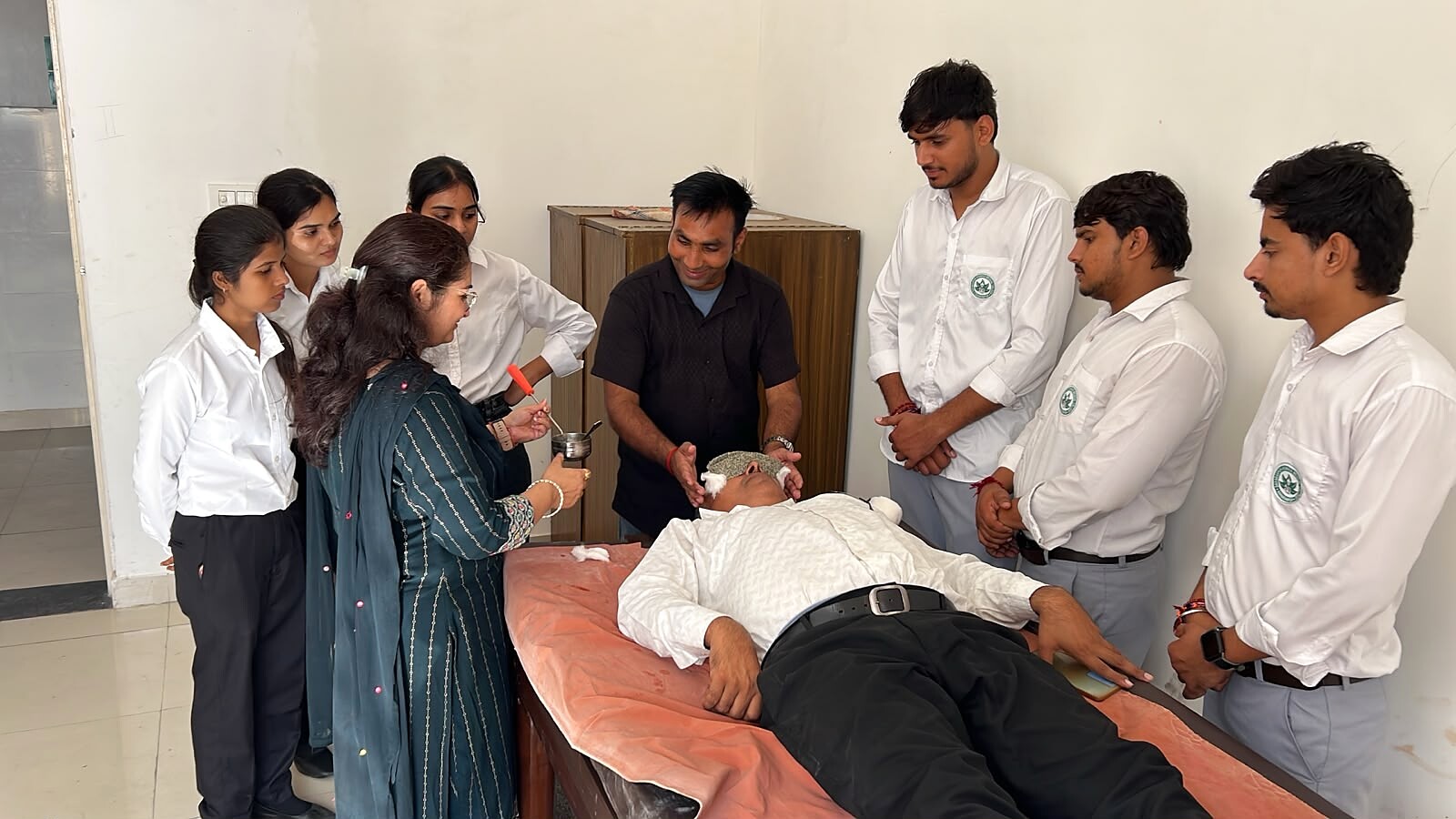 Students observing a supervised Panchakarma therapy session